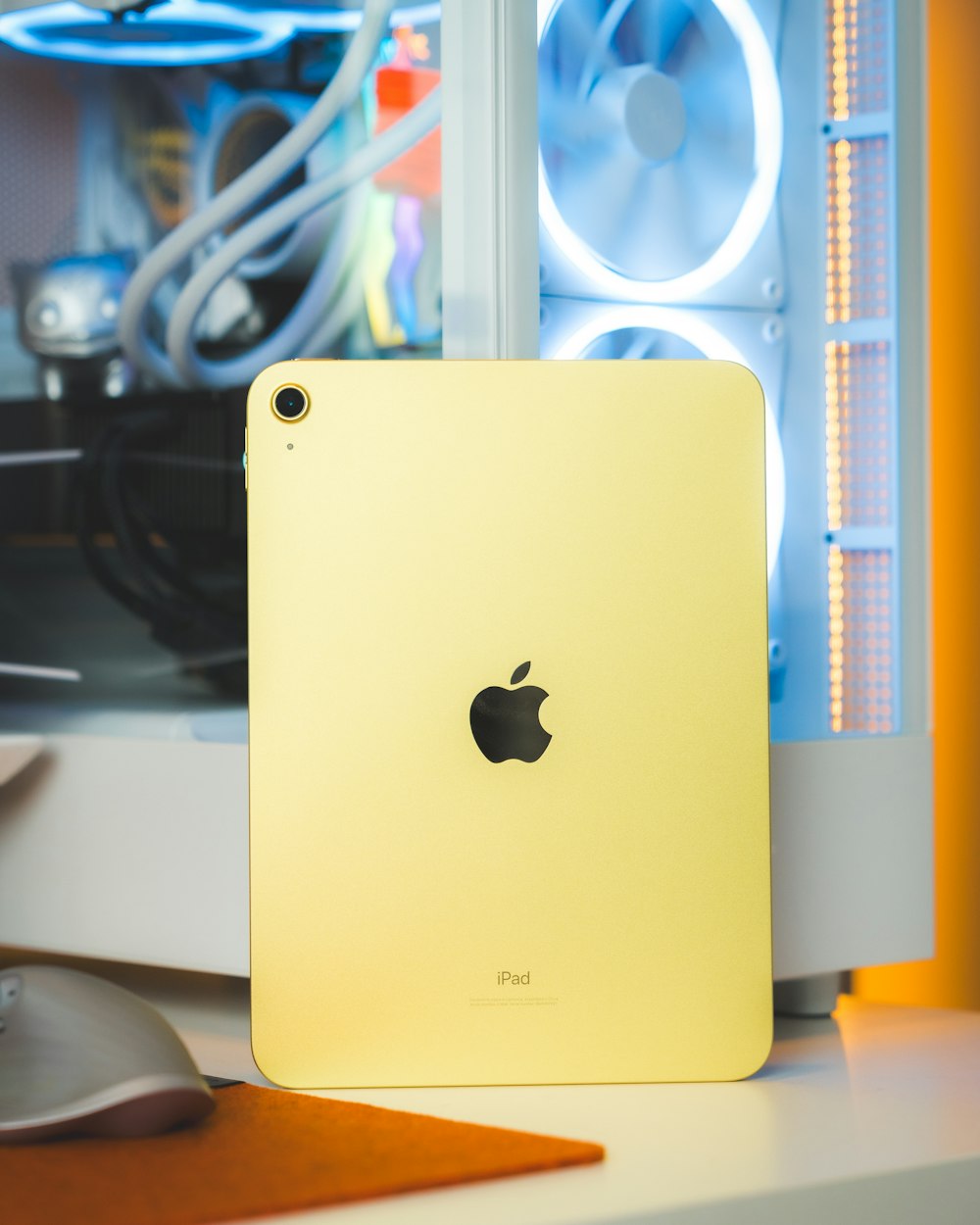 a yellow ipad sitting on top of a desk
