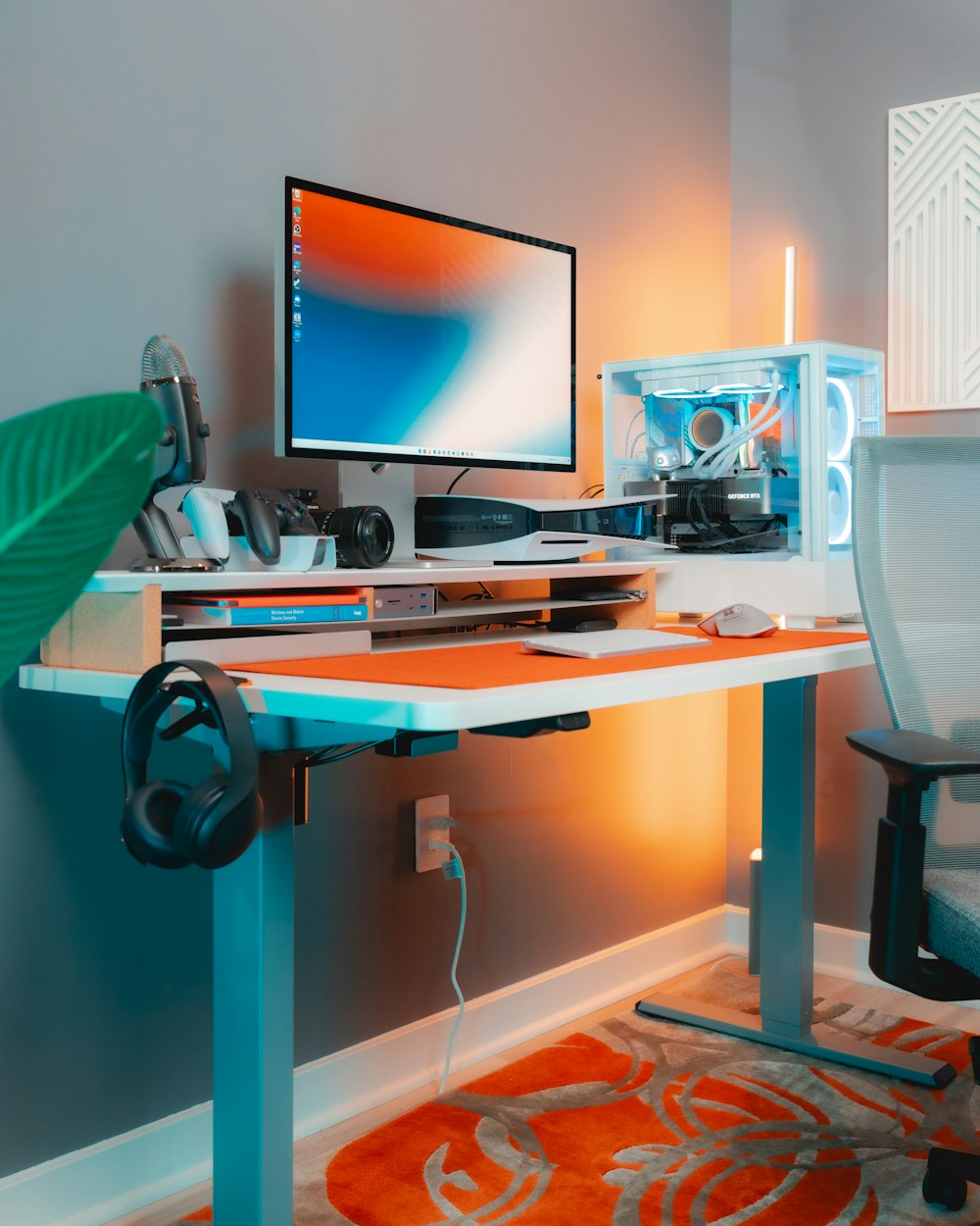 a desk with a computer monitor, keyboard and mouse