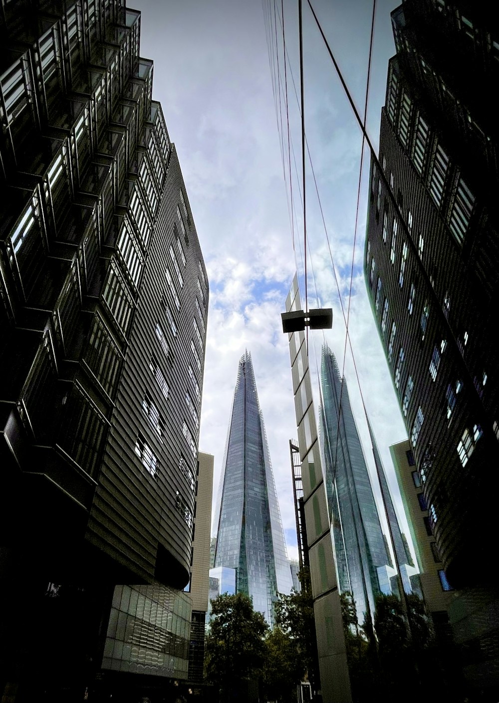 a view of some very tall buildings in the city