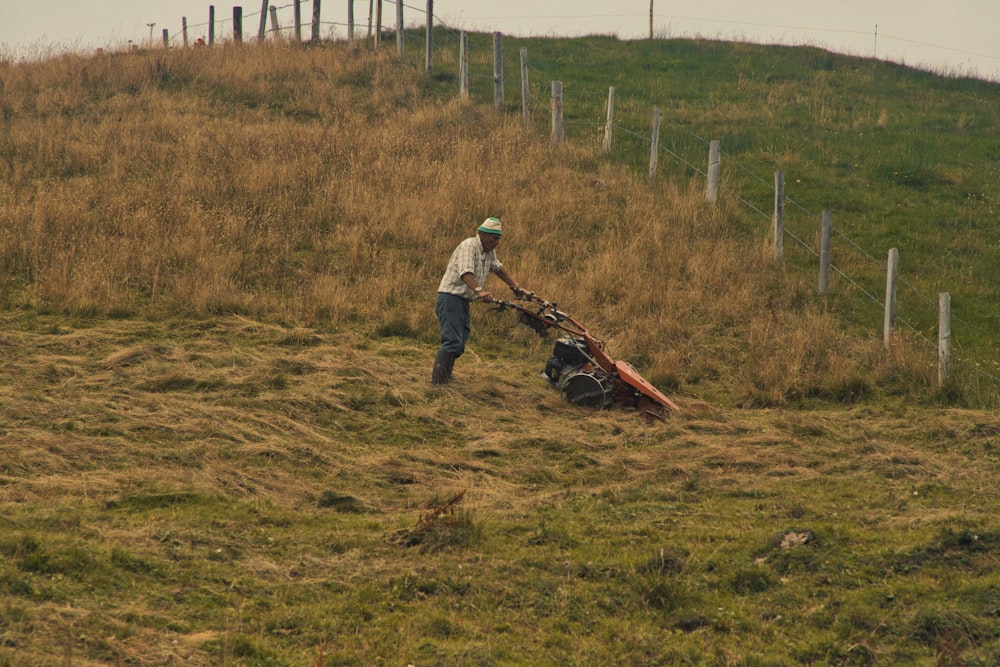 a man standing on top of a lush green hillside