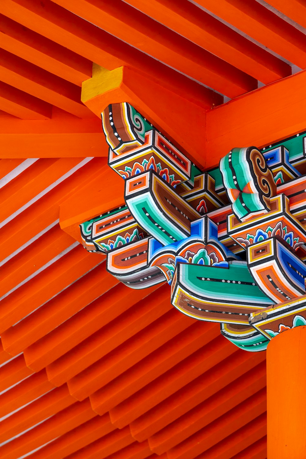 a close up of an orange structure with designs on it