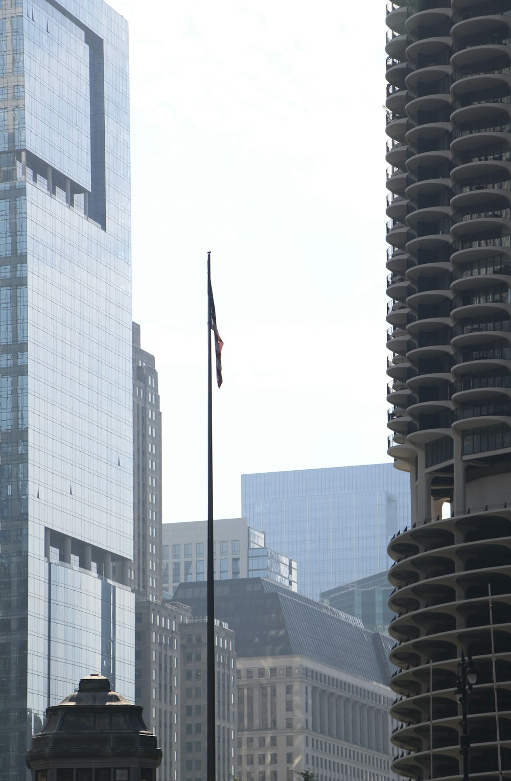a tall building with a flag on top of it