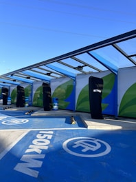 a group of surfboards sitting on top of a blue ramp