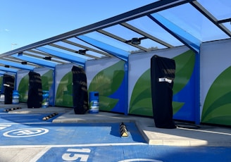 a group of surfboards sitting on top of a blue ramp