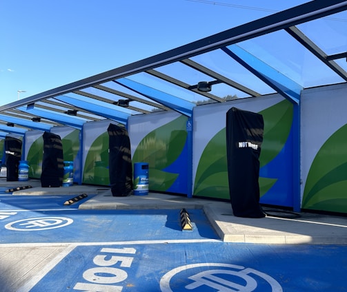 a group of surfboards sitting on top of a blue ramp