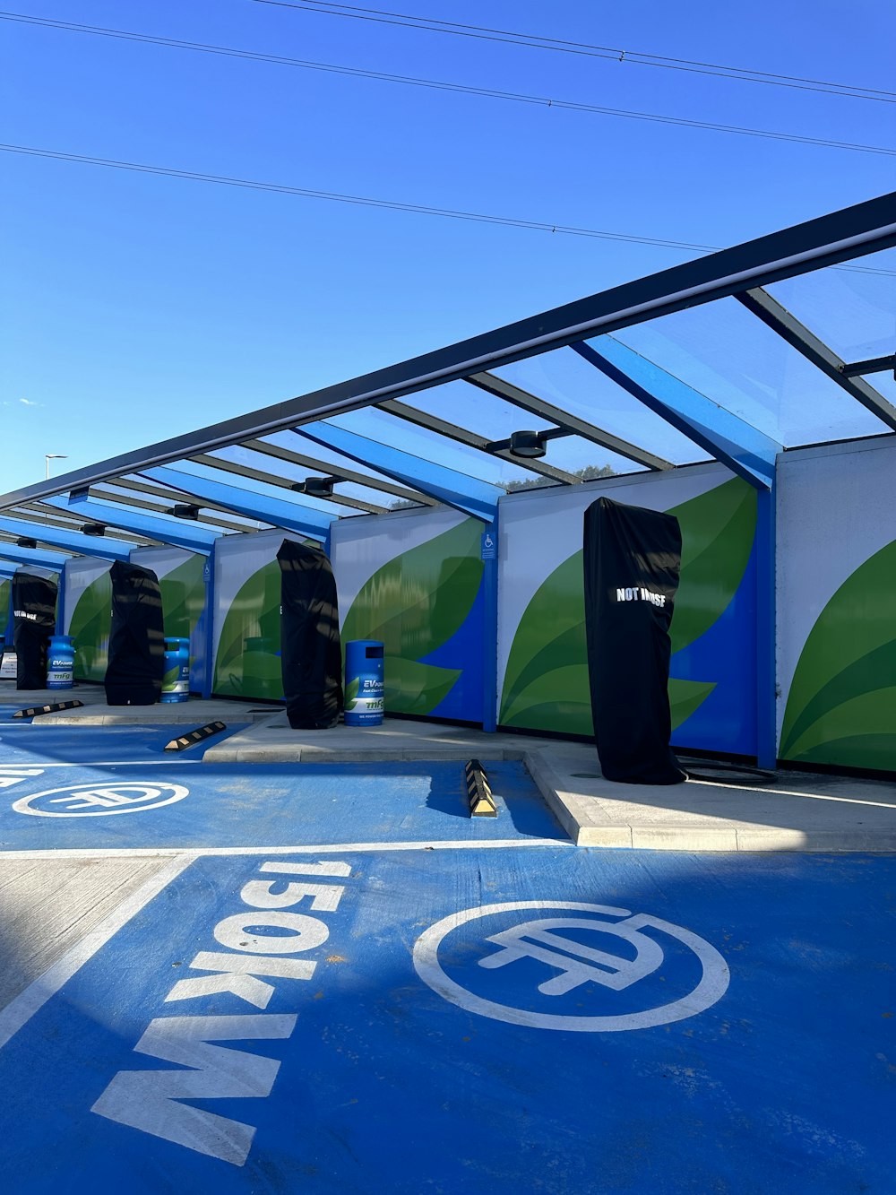 a group of surfboards sitting on top of a blue ramp