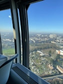 A panoramic view from the Shanghai Tower observation deck, overlooking the bustling city below.
