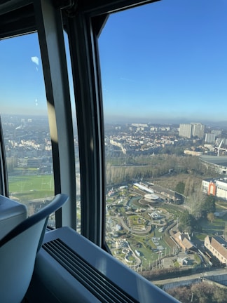 A panoramic view from the Shanghai Tower observation deck, overlooking the bustling city below.
