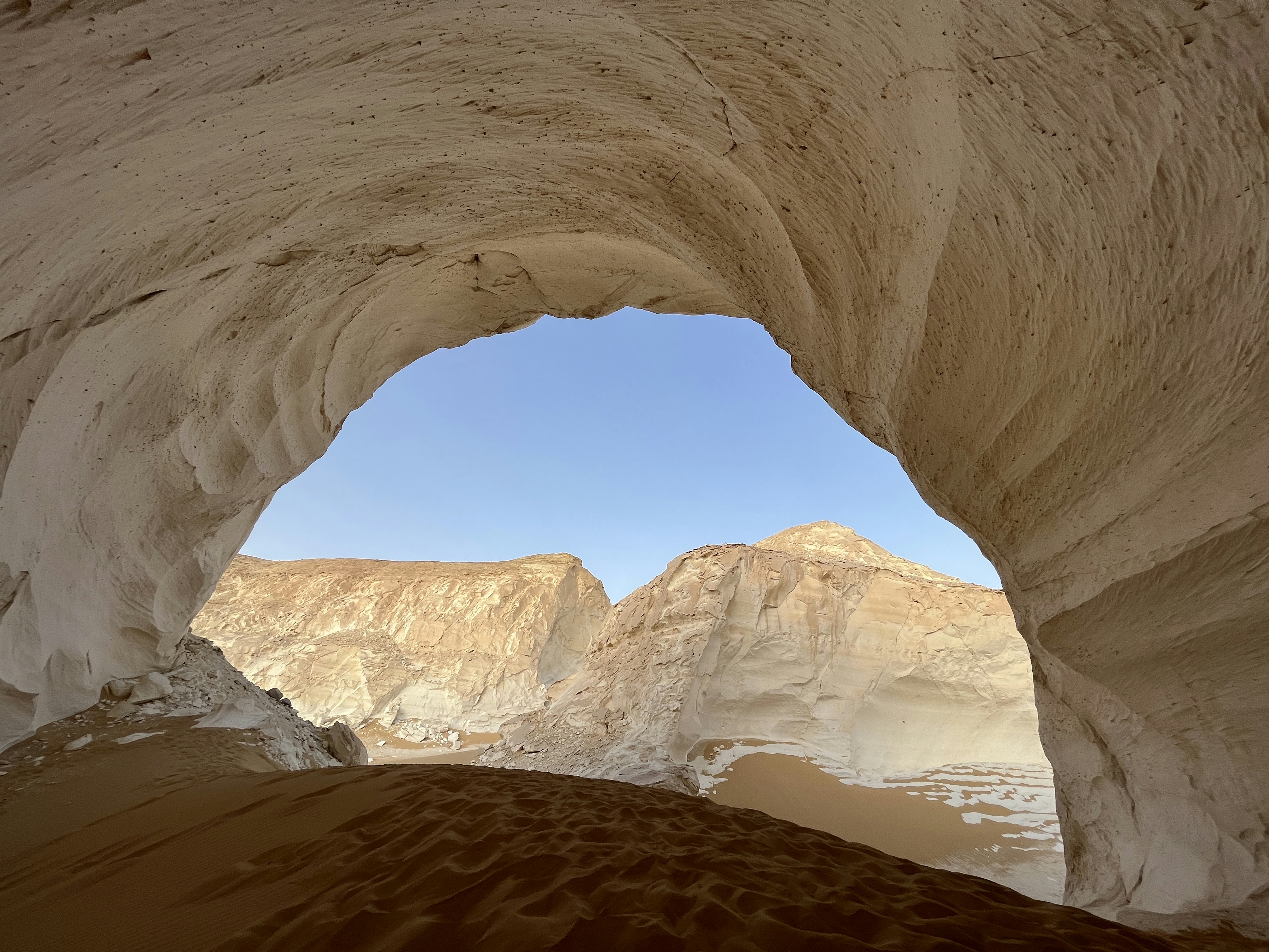 A view from inside of a cave in the desert