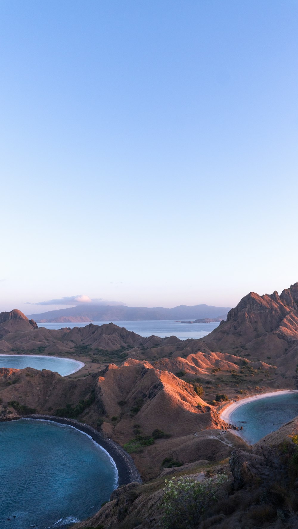 a scenic view of a beach and a body of water