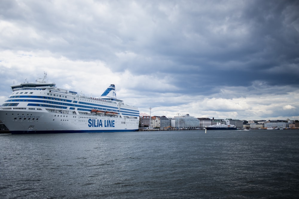 a large cruise ship docked in a harbor