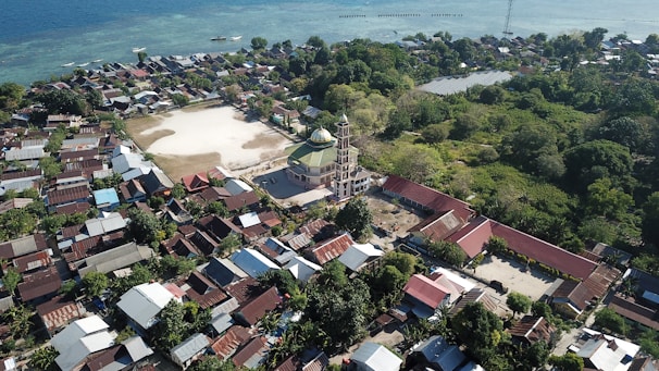 a bird's eye view of a small town by the ocean