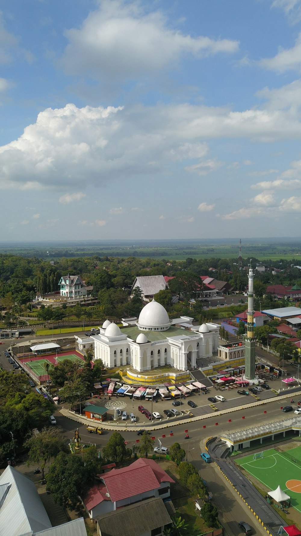 an aerial view of a large white building