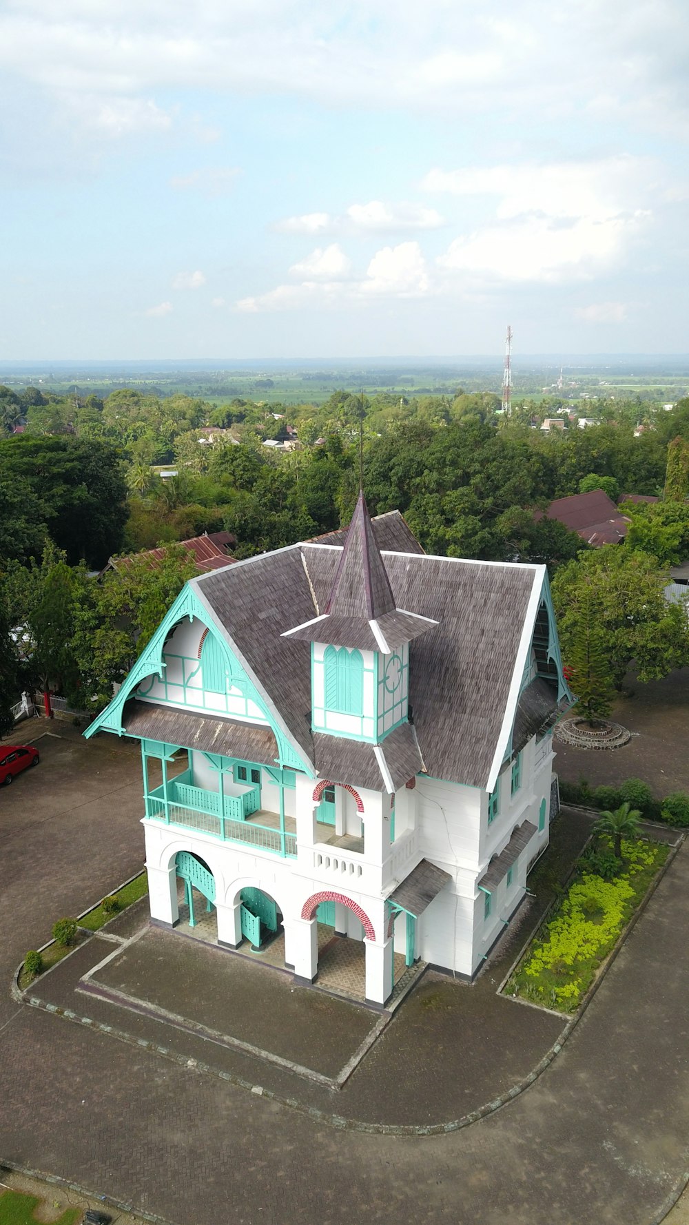 an aerial view of a large white house