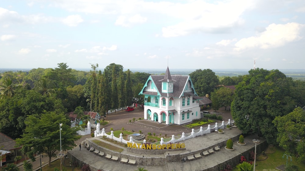 an aerial view of a large white house