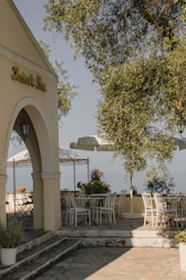 Quiet outdoor patio space with comfortable seating and greenery.