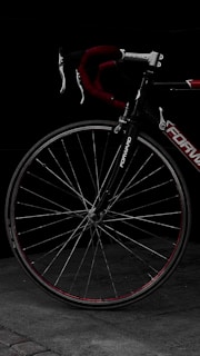 A close-up of a bicycle's carbon fiber frame showcasing its intricate texture and design.