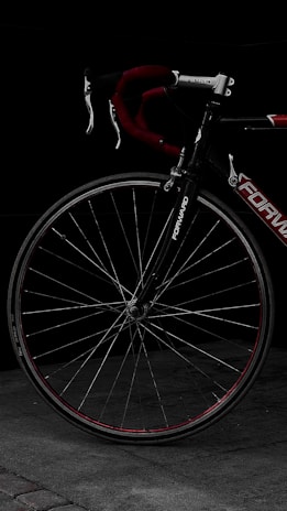 A close-up of a bicycle's carbon fiber frame showcasing its intricate texture and design.