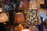 A collection of custom-designed table lamps showcasing various finishes and colors.