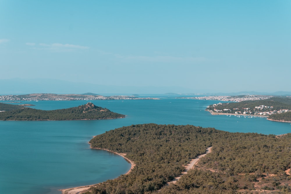 an aerial view of a lake surrounded by trees