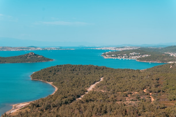 A scenic view of Ilha Grande coastline with lush greenery and clear blue waters.