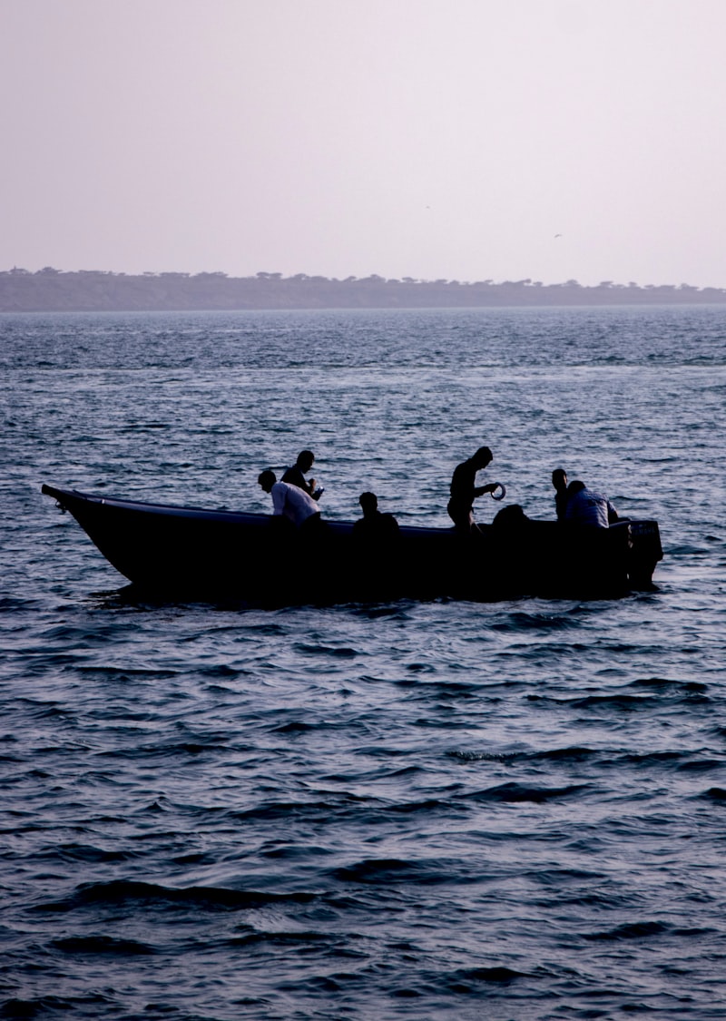 a group of people riding on the back of a boat