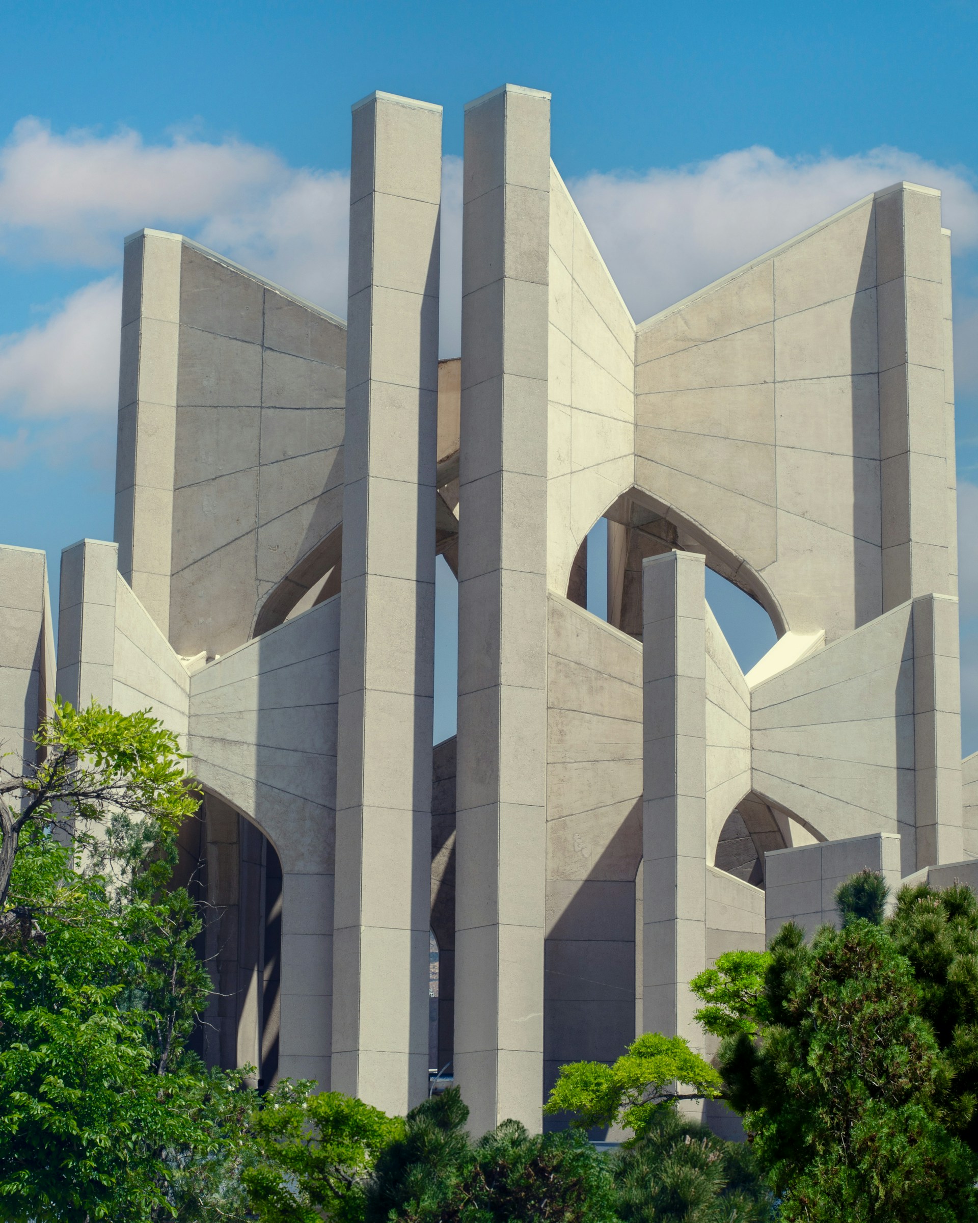 woman wearing yellow long-sleeved dress under white clouds and blue sky during daytime