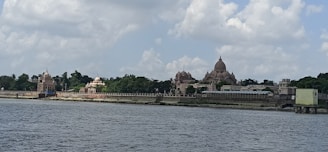 View of the hotel exterior near the serene Namo Ghat by the river.