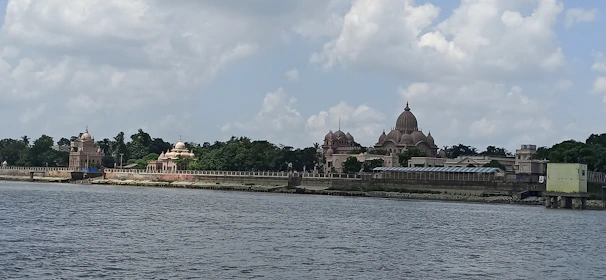 Serene view of Ayodhya’s Ram Mandir framed by lush greenery and gentle morning light.