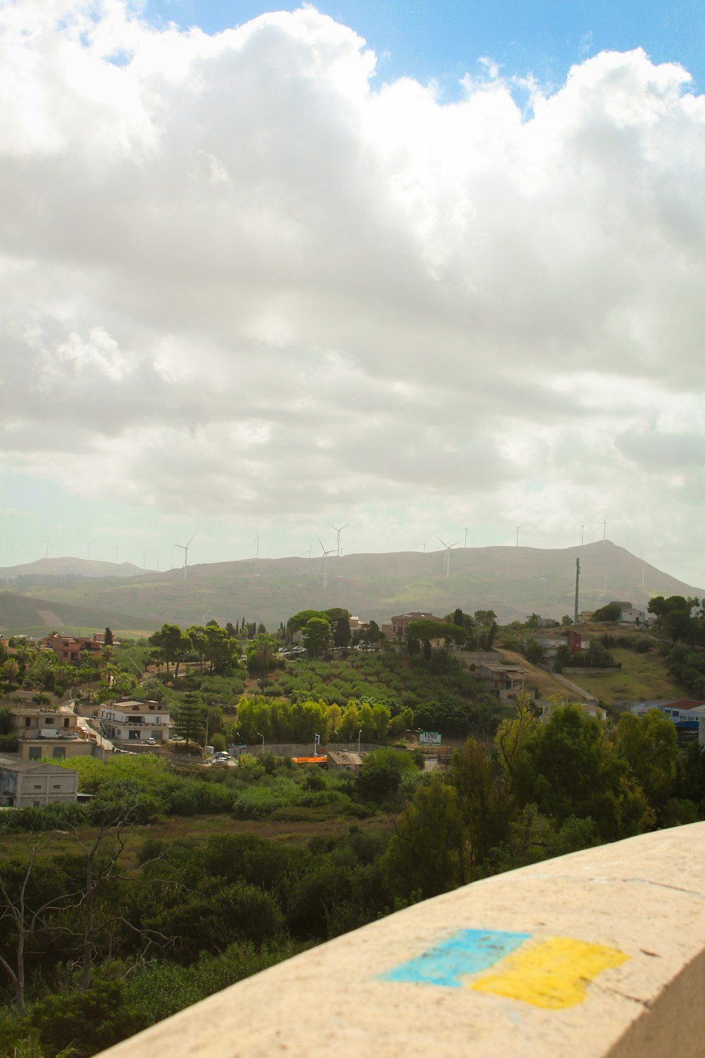 a view of a city with hills in the background