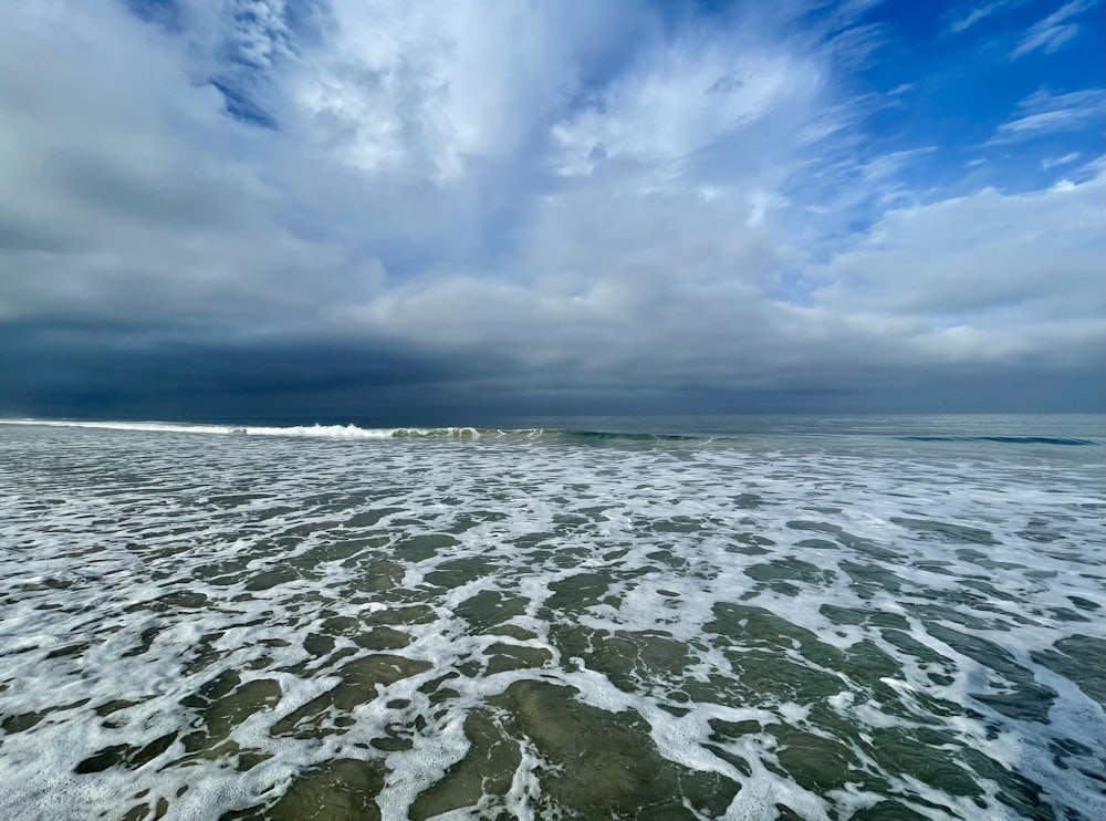 a view of a body of water under a cloudy sky