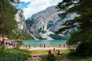 Picturesque mountain view with clear blue skies and people enjoying the scenery.
