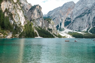 The serene waters of Lake Titicaca with floating reed islands and boats.