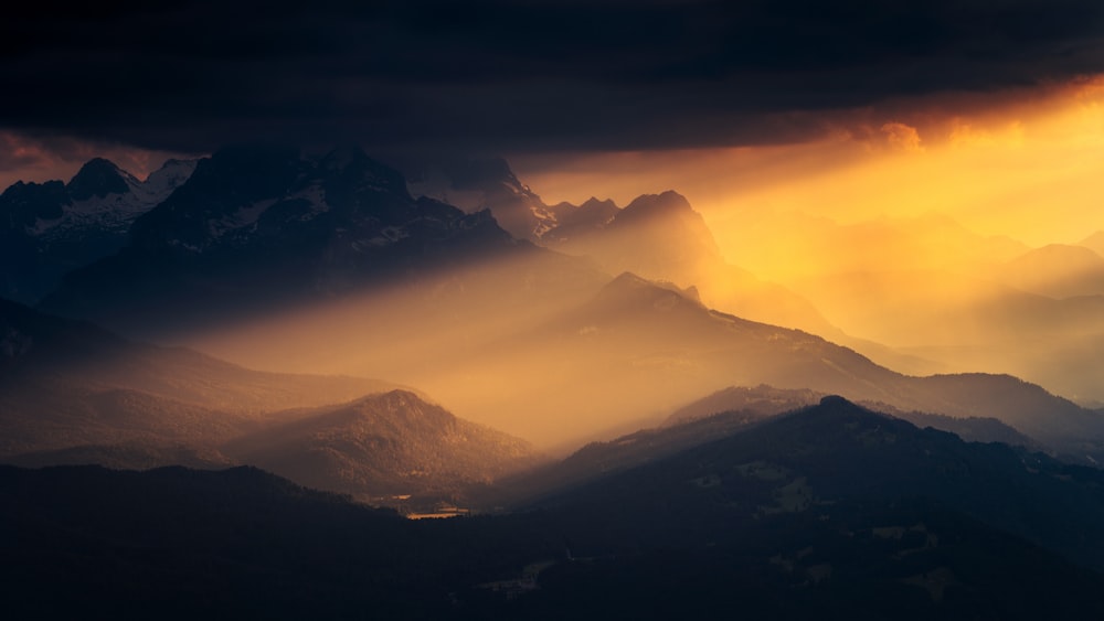 a view of a mountain range at sunset