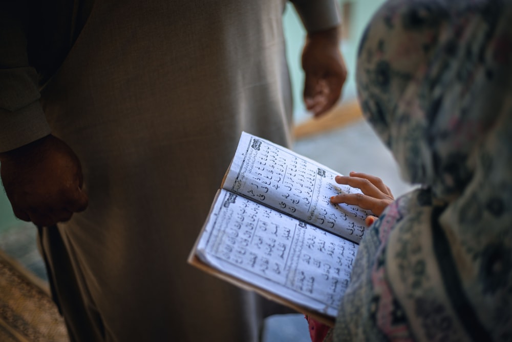 a person holding a book in their hands