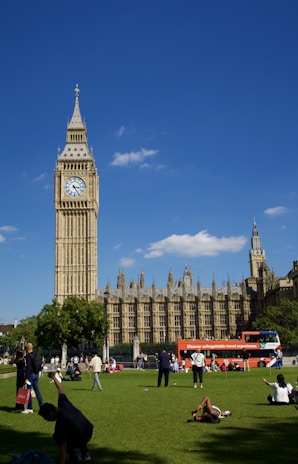 A scenic view of London with people enjoying a sunny day.
