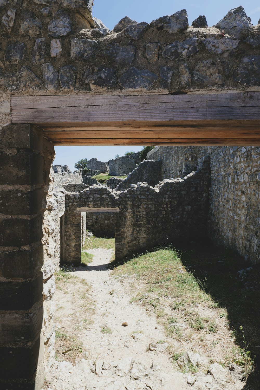 a stone building with a doorway leading to another building