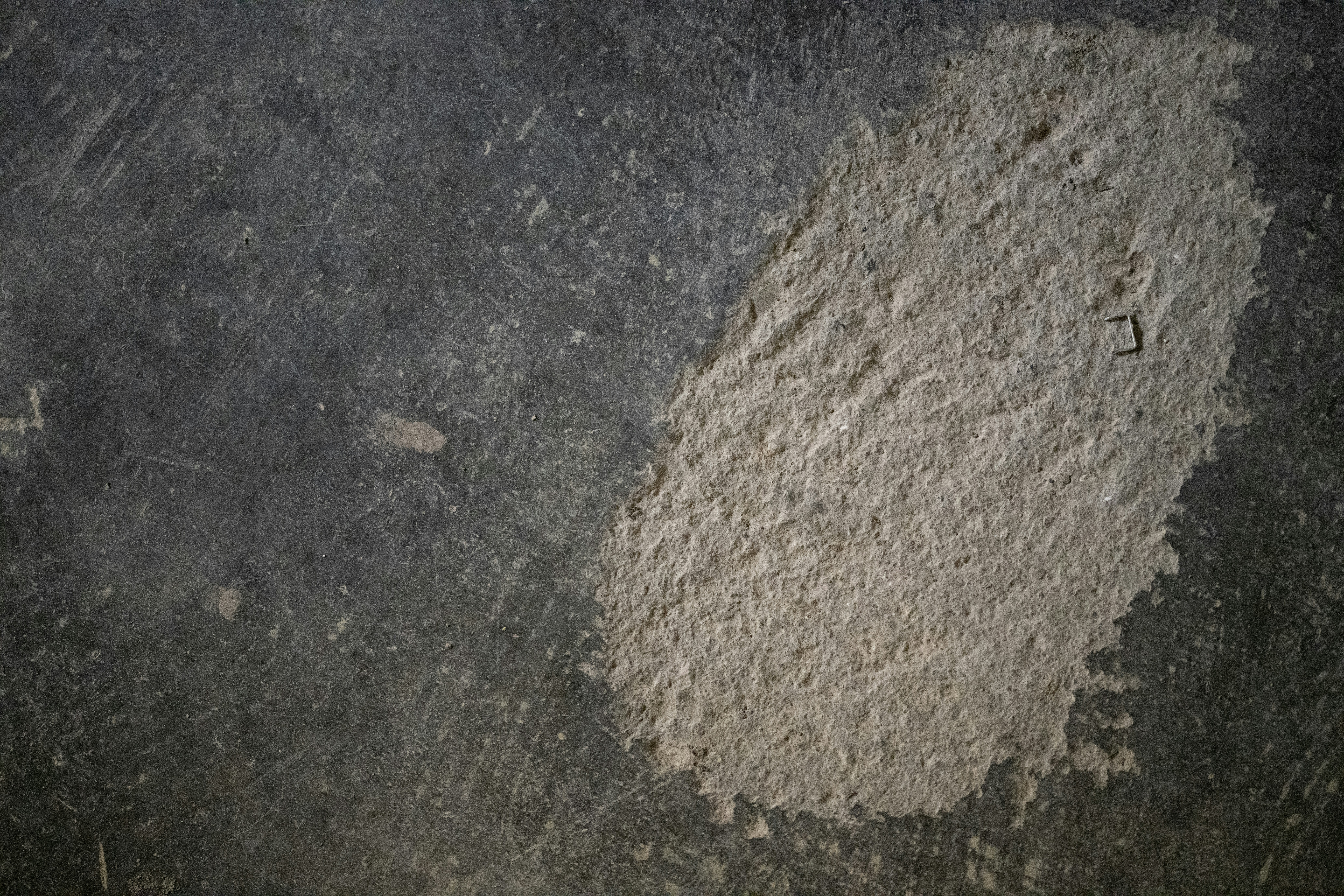 a black and white photo of a cement wall