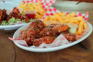 two plates of food on a wooden table