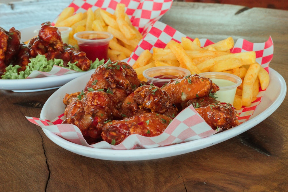 two plates of food on a wooden table