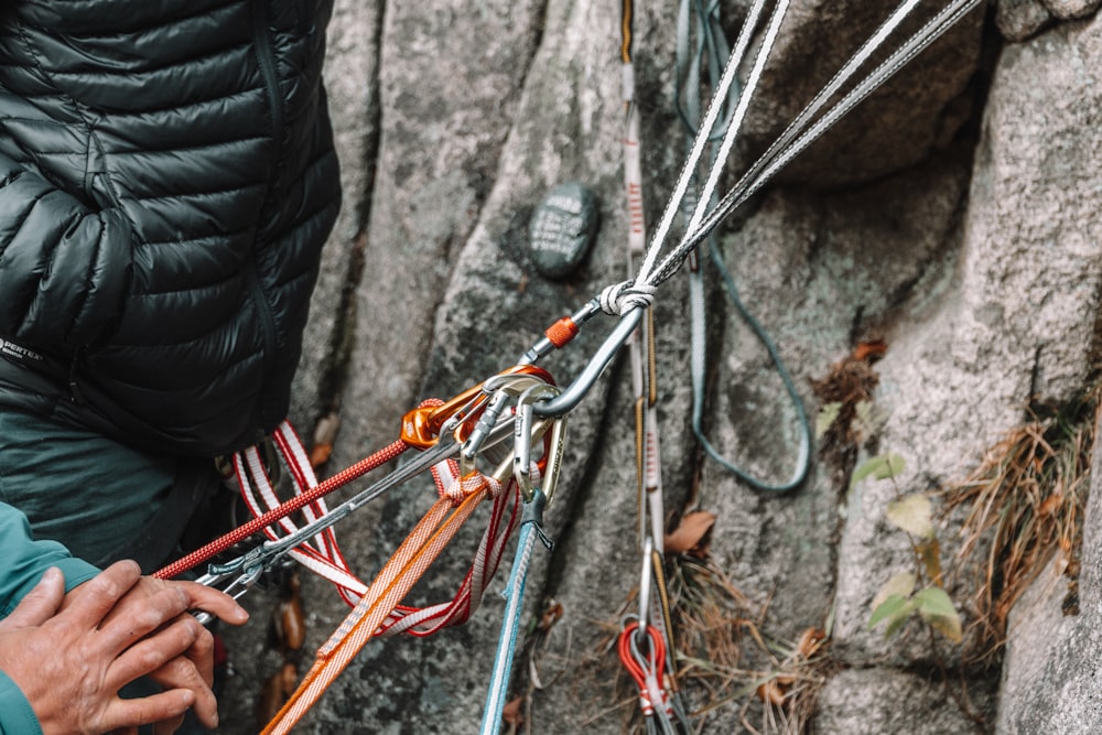 a man is tying a pair of skis to a rope