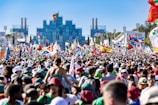 An outdoor evening event with Indian and Russian flags fluttering, surrounded by engaged attendees.