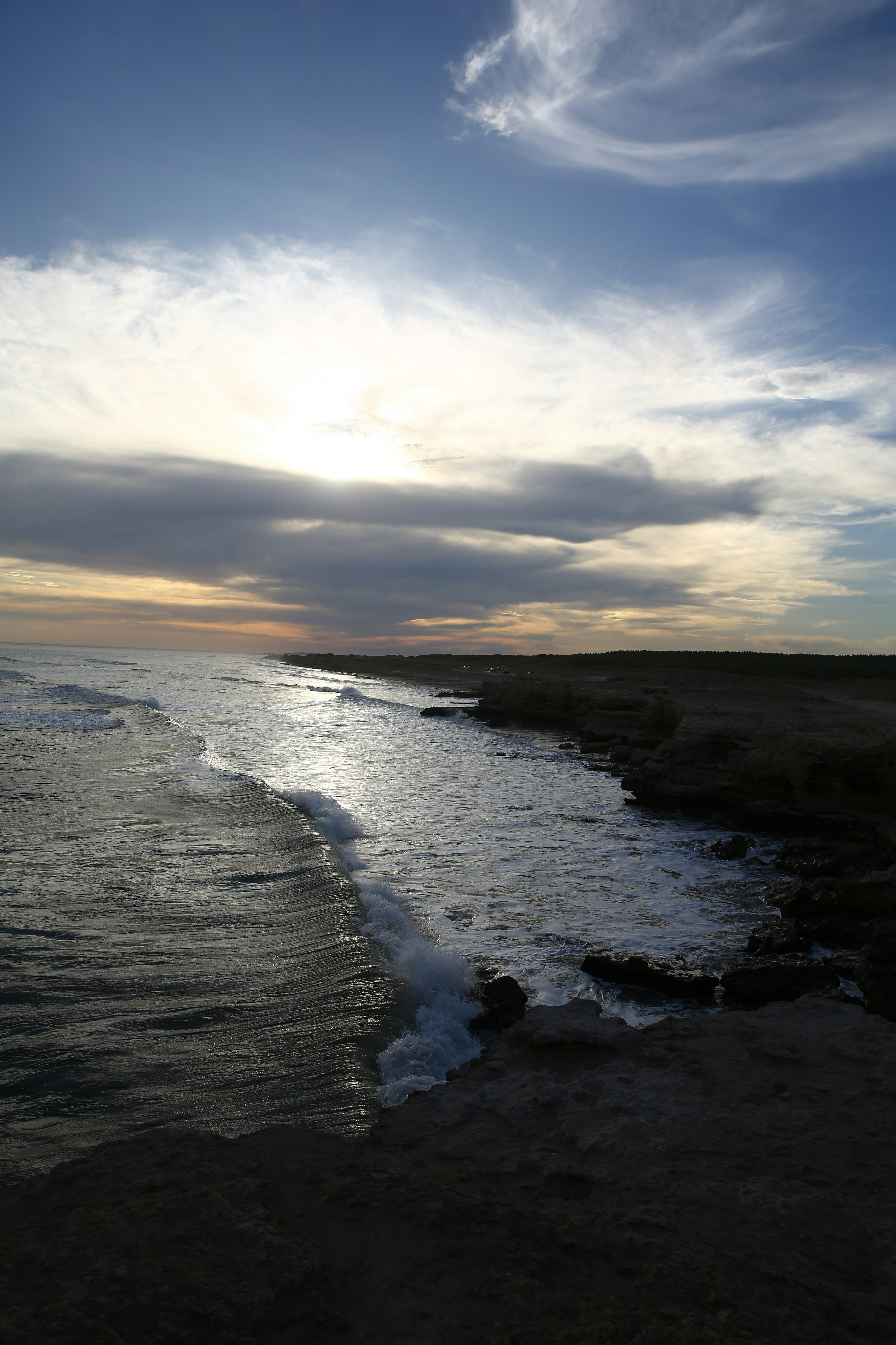 a body of water with waves coming in to shore