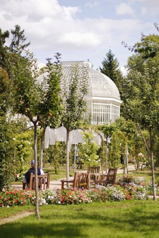 Outdoor garden space at a care home with benches and greenery for peaceful walks
