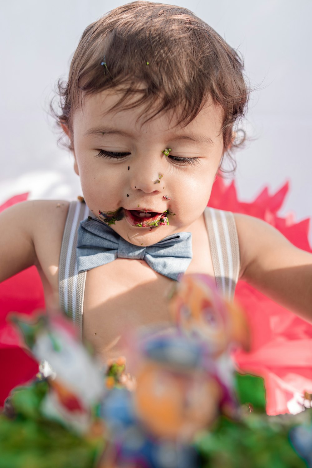 a toddler with food all over his face