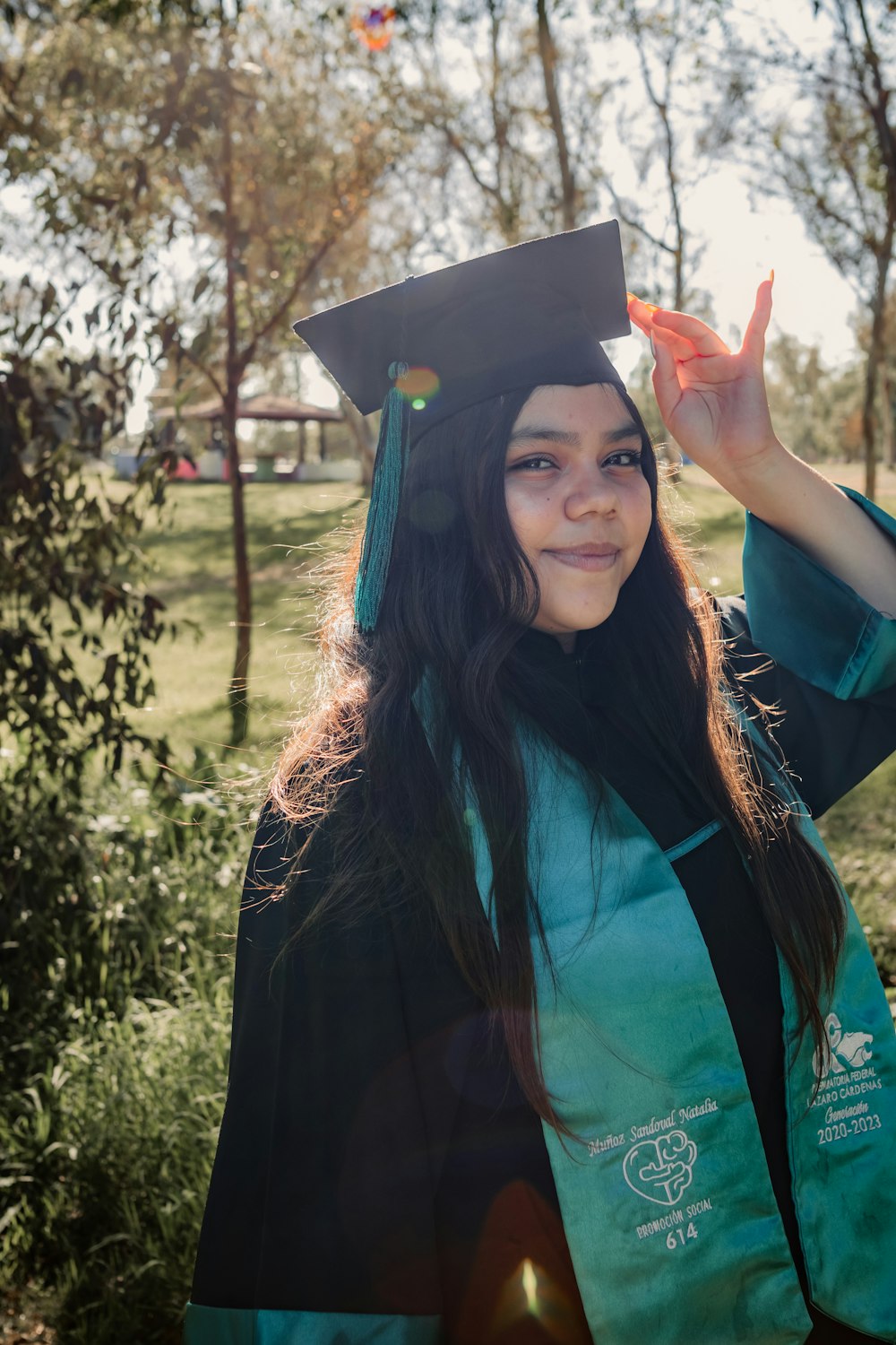 a woman in a graduation cap and gown