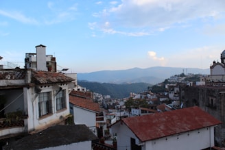 A scenic view of a traditional Portuguese village with whitewashed houses and vibrant flowers.