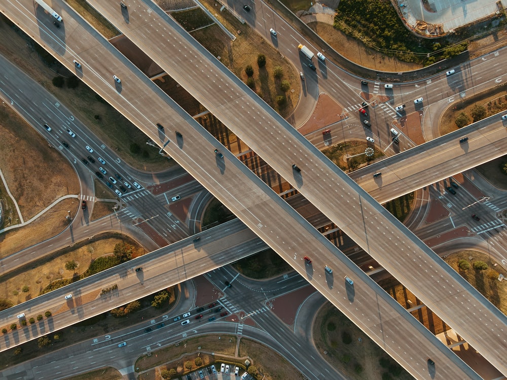 an aerial view of a highway intersection with multiple lanes