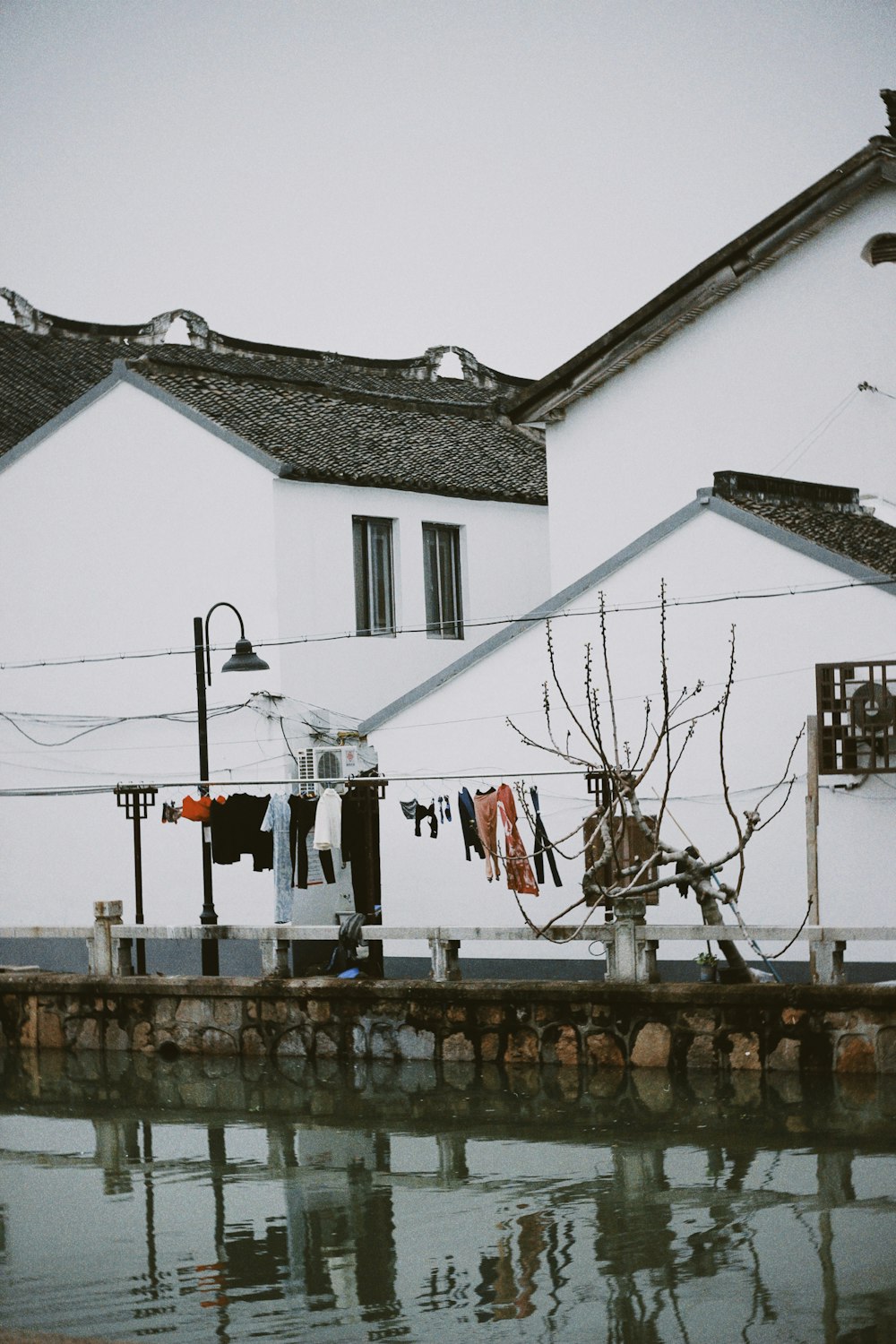 clothes hanging out to dry in front of a house