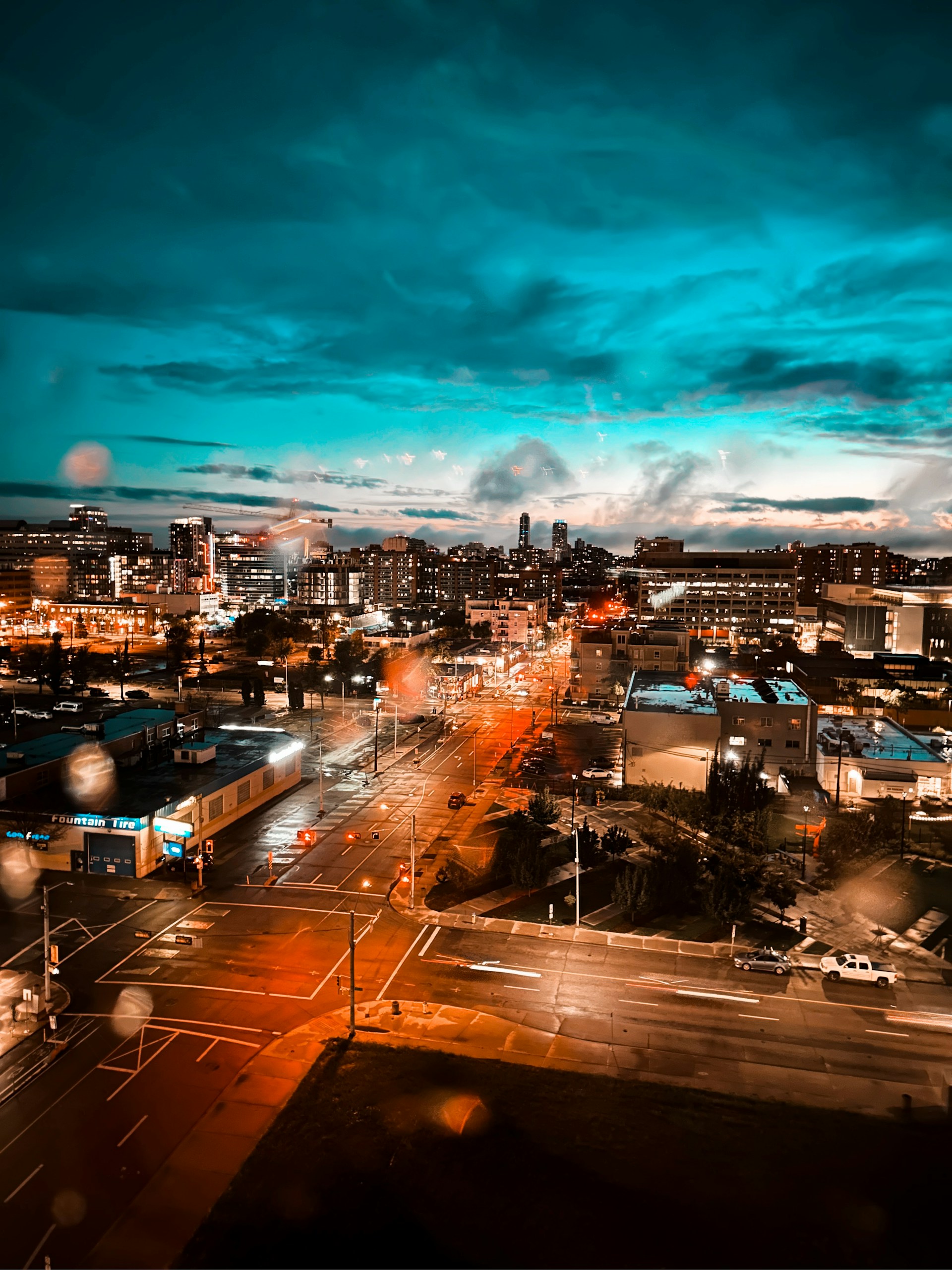 A vibrant cityscape at dusk, showcasing the dynamic energy captured through expert photo editing.